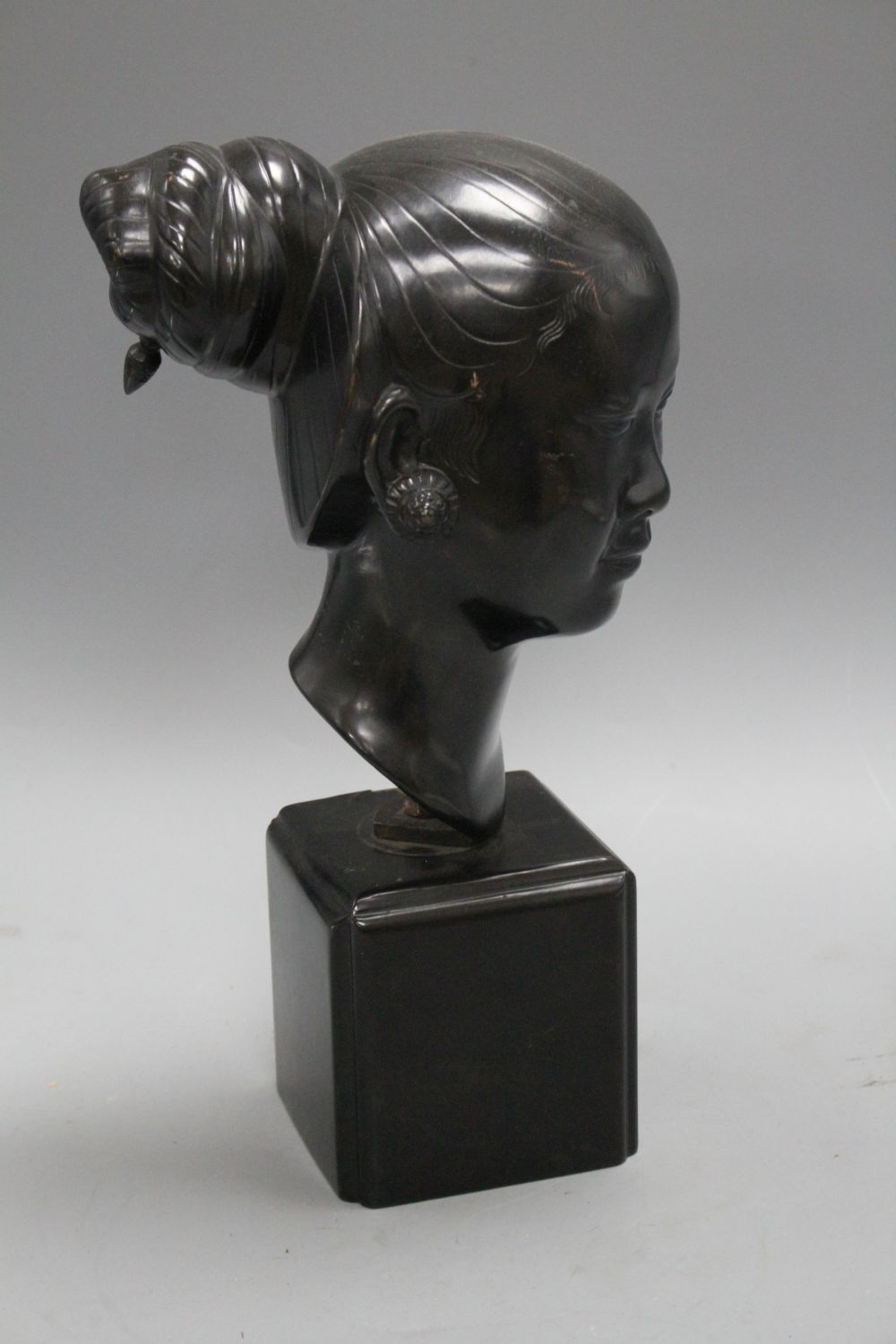 Nguyen Thanh Le (1919- Vietnam). A bronze head of a Vietnamese woman,